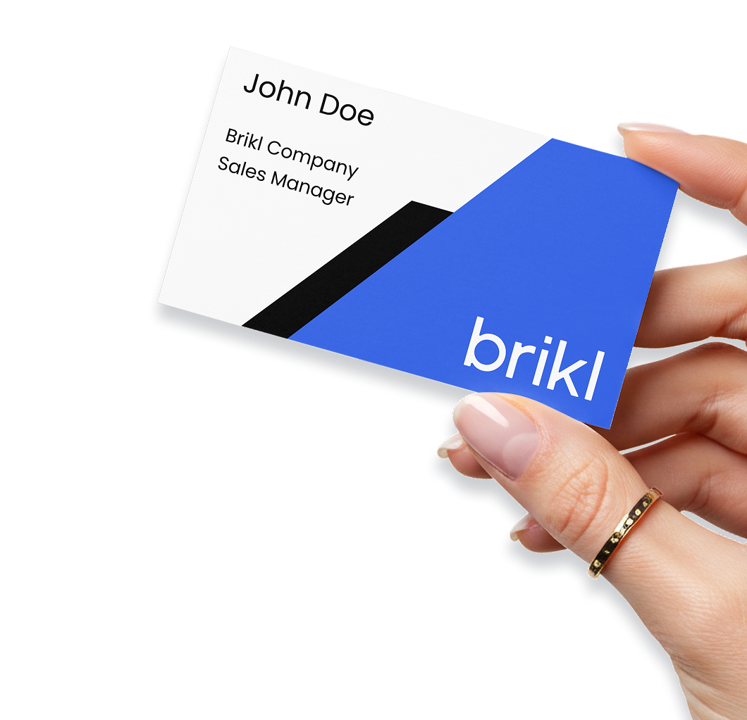 Hand holding a personalized business card — on-demand business cards printed by Taylor OnDemand through Brikl